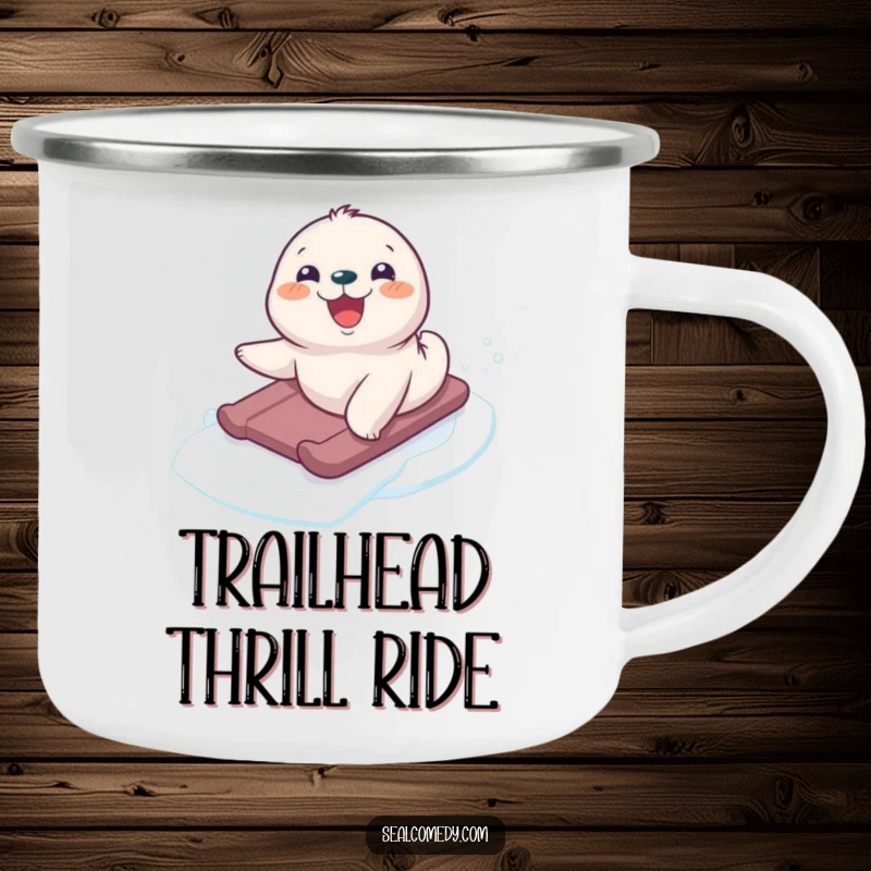 Funny seal pup sliding down an icy slope, depicted on a sturdy camping mug, ready for outdoor adventures.