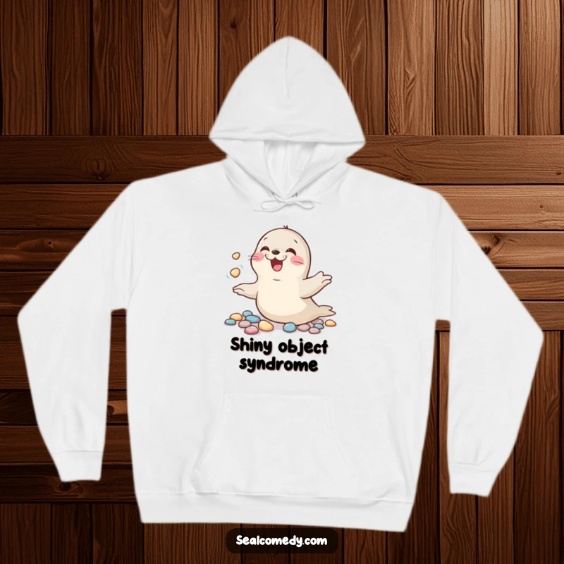 Funny hoodie featuring a happy seal juggling pebbles, perfectly capturing a moment of pure, giggling fun.