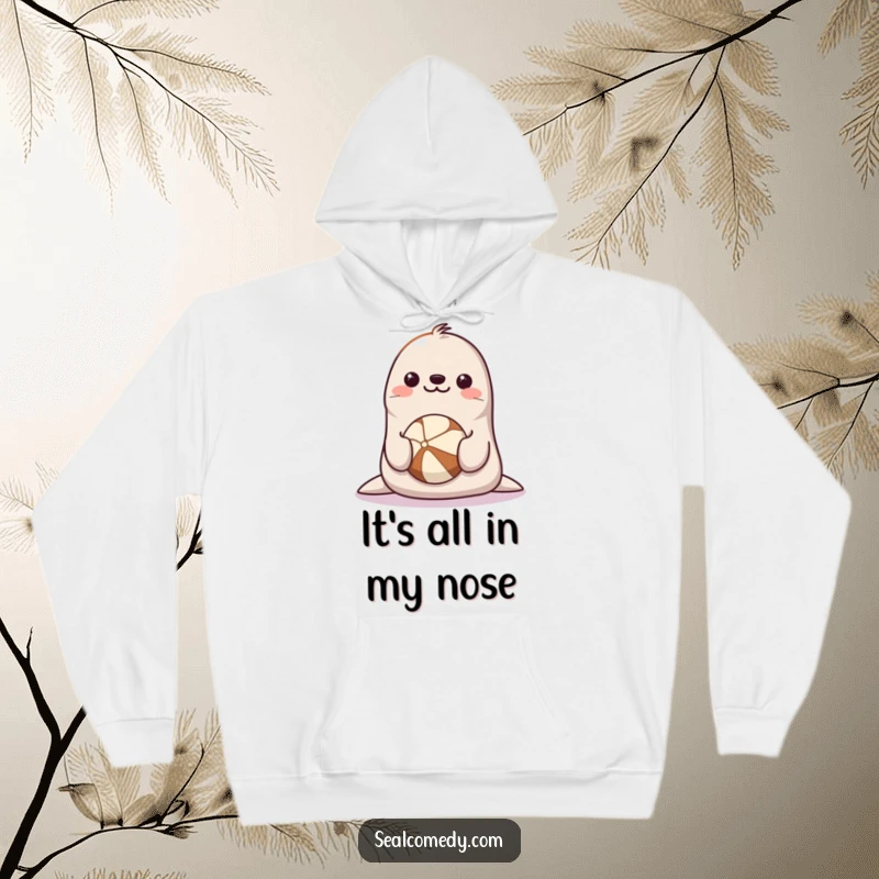 Funny Seal Hoodie: A happy seal with a big smile is skillfully balancing a round ball on the tip of its nose.