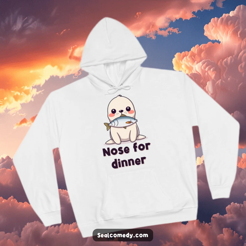 Funny Hoodie: A seal balances a fish on its nose, showcasing impressive and humorous aquatic skills.