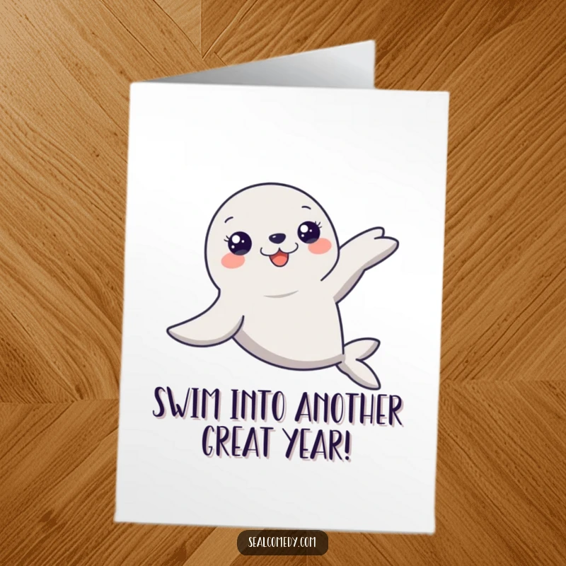 Free printable birthday card featuring a graceful seal with extended flippers smoothly gliding through water.