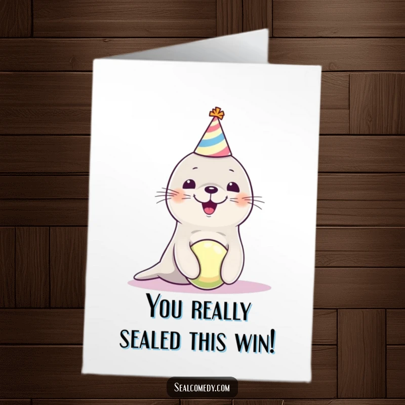 Funny Free Printable Congratulations Card: Seal pup adorably balances a ball, celebrating your big win with pure joy.