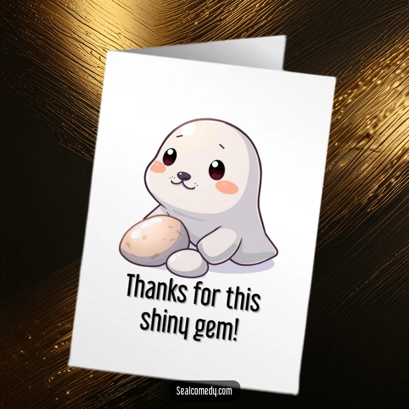 Funny Free Printable Thank You Card: A seal nudging a shiny pebble with its snout, like a small gift.