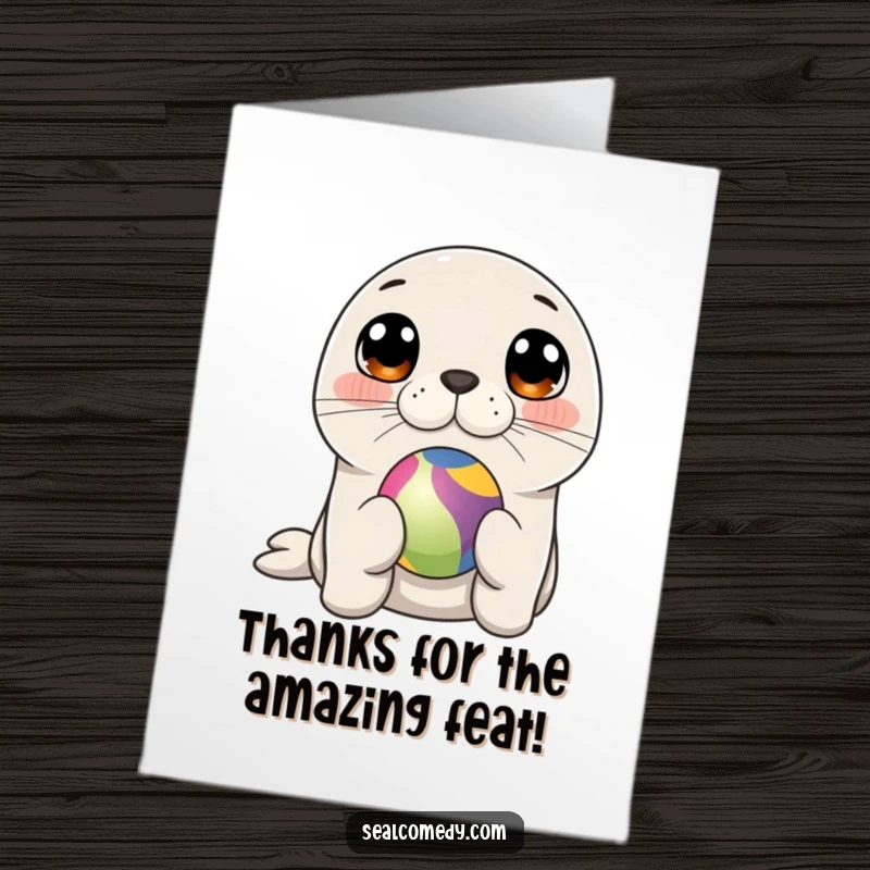 Funny Free Printable Thank You Card: A cute seal with curious eyes balances a colorful ball on its nose, expressing thanks.