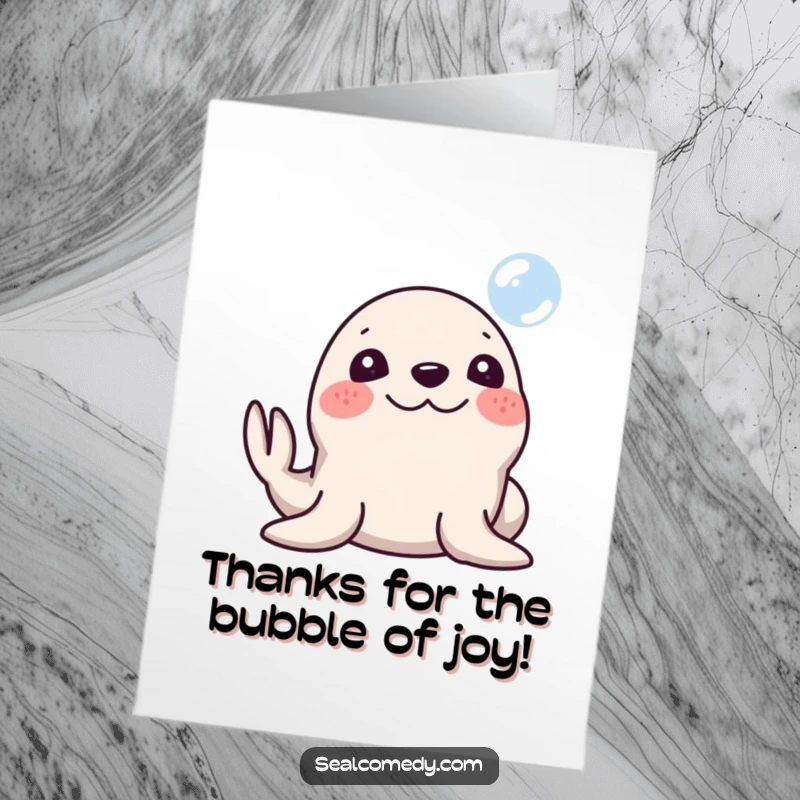 Funny free printable thank you card of a silly seal with a big smile honking its nose at a bubble.
