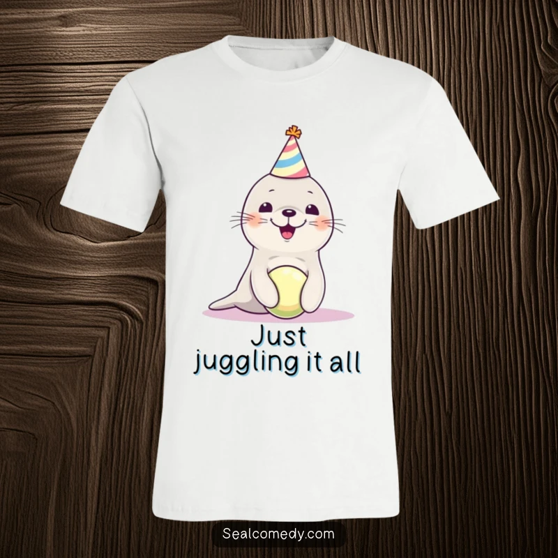 Funny seal pup in a party hat, expertly balancing a ball, printed on a comfortable tee, evoking pure joy and celebration.