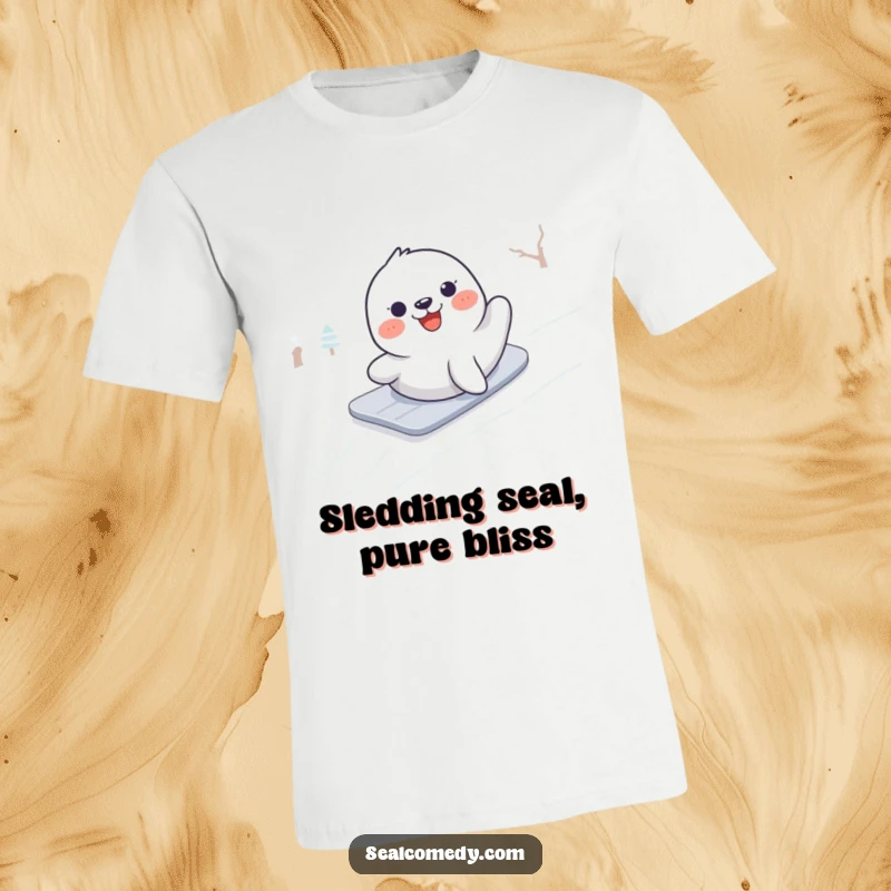 Funny t-shirt graphic of a gleeful seal in motion, enthusiastically sliding down a snow-covered hill with a big smile.