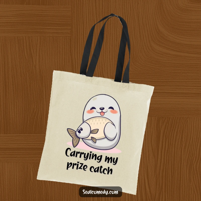 Funny seal tote bag showing a proud seal catching a fish, perfect for carrying items with humor and a fishing theme.