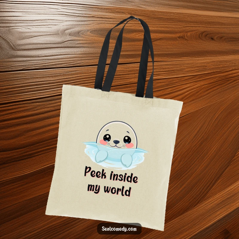 Funny seal pup with wide, curious eyes, peeking out of the water, showcased on a durable and charming tote bag.