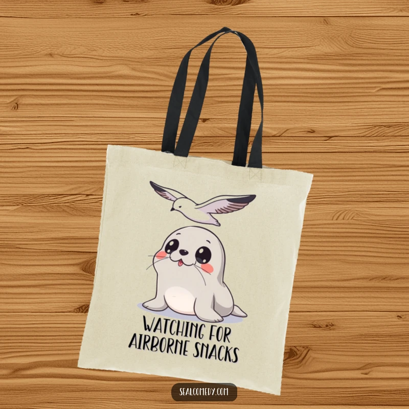 Funny Seal Tote Bag: Wide-eyed seal gazing upwards at a seagull, a humorous and practical bag for observers.